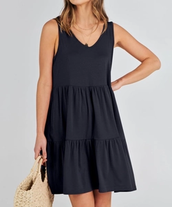 Detail view of a black V-neck tiered sleeveless dress for summer casual style