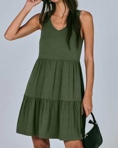 Detail of dark green V-neck sleeveless tiered dress with a soft knit texture