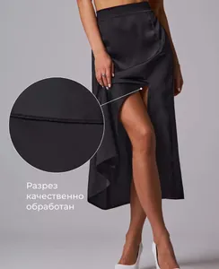 Detail of high-quality stitching on the side slit of this black satin midi skirt