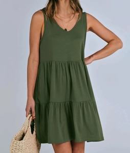 Detail view of V-neck sleeveless layered mini dress in olive green with pleated texture