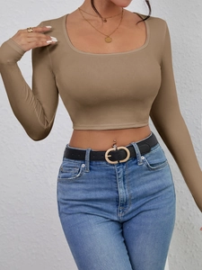 Close-up of brown ribbed long sleeve crop top with U-neckline and slim fit design