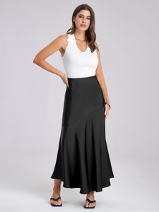 Detail of the elegant black satin maxi skirt showing glossy fabric and seamless stitching