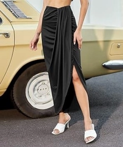 Detail of elegant black midi skirt with ruched draping and stylish side split for women