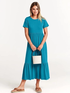 Detail of tiered pleated peacock blue dress with round neck and high waist silhouette