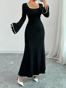 Elegant square neck long sleeve black knit dress with contrast white trim and flare cuffs