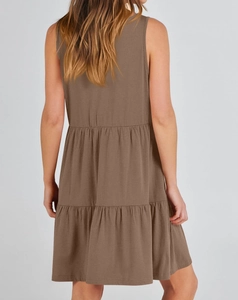 Rear view of brown sleeveless tiered ruffle dress with layered cake skirt design