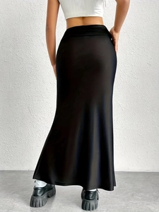 Elegant high-waisted black satin maxi skirt with a slim fit and fishtail hemline