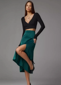 Close-up of elegant satin midi skirt with side slit detail and smooth silky texture