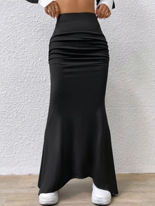 Detail shot of the black high-waisted ruched knit mermaid skirt with ankle-length cut