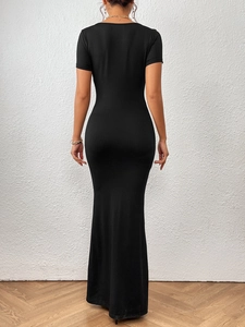 Elegant slim fit black square neck fishtail maxi dress shown from a back view perspective