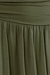 Detail of army green knitted skirt waist featuring elegant pleated texture and soft fabric