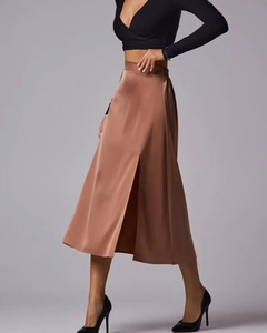 Detail of high waist satin midi skirt with side slit in smooth coffee brown fabric