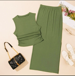 Detailed view of green ribbed knit fabric texture on summer tank top and maxi skirt set