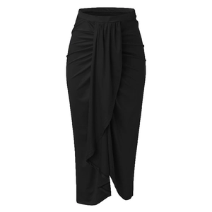 Detail of high waist draped black sarong skirt showing elegant wrap front and ruched texture