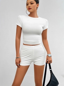 Women's two-piece white slim fit set featuring a crop top and high-waisted shorts