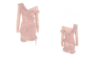 Detail of pink lace dress with white polka dots, ruffles, and side drawstring design