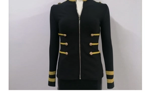 Detail of military-style black jacket with golden decorative buttons and metallic zipper