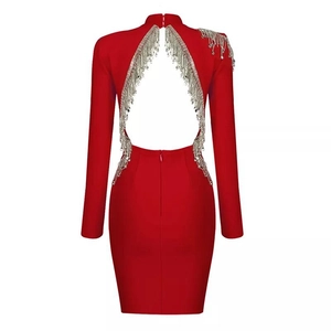 Red bodycon dress with long sleeves, high neck, open back, and silver rhinestone fringe