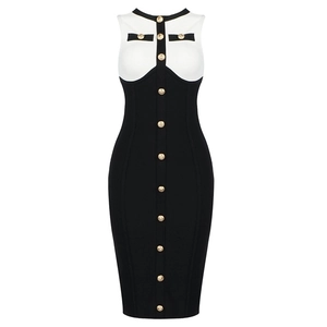 Elegant sleeveless black and white patchwork dress with decorative gold buttons