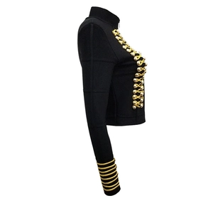 Detail of military-style black jacket featuring gold braided trim and embossed metal buttons