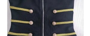 Detail of black jacket with gold cord military braiding and lion head buttons