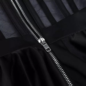 Black strapless evening dress with ruffle trim and vertical silver metal zipper detail