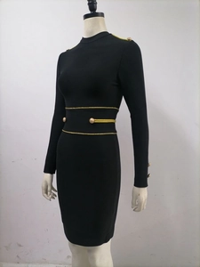 Women's black long sleeve bodycon dress with gold buttons and decorative waist ribbons