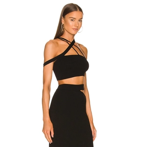 Ensemble chic deux pièces en maille noire avec crop top licou et jupe longue ajourée