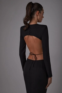 Detailed back view of long sleeve black bodycon dress with cut-out and button accents