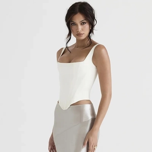 Slim fit white square neck corset top paired with a shiny silver satin long skirt