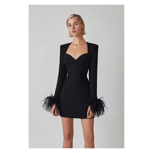 Slim fit black long sleeve mini dress with feather cuffs and structured corset bodice