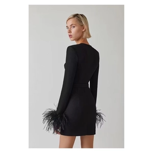 Slim fit black long sleeve dress with feather cuffs and cutout chest design for women