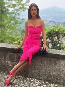 Detail of hot pink strapless midi dress featuring a unique curved layered neckline