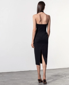 Elegant black halter backless midi dress with slim fit silhouette and back slit detail