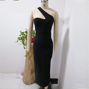 Detail of black one-shoulder dress featuring cut-out neckline and rhinestone accents