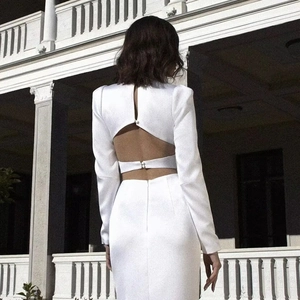 Elegant white backless V-neck maxi dress with long puff sleeves and button details