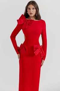 Close-up of red long sleeve bandage dress with large bow accents and side cutouts