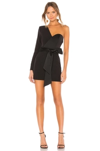 Detail of black one-shoulder bandage dress with a large satin bow at the waist