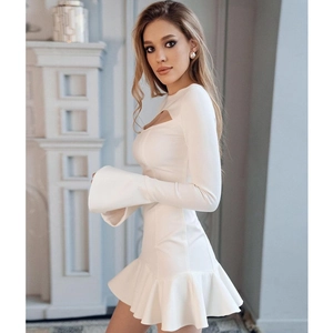 Elegant white long sleeve dress with cutout detail, flared cuffs and ruffle hem