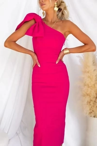 Close-up of a rose red bodycon dress featuring an oversized bow on the single shoulder