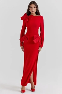 Detail of red party dress showing oversized shoulder bow and waist cut-outs with bows