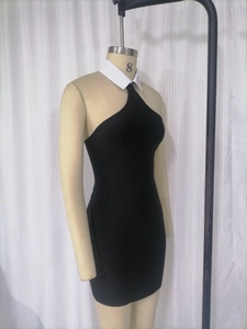 Detail view of the contrast white collar and halter neckline on a black bandage dress