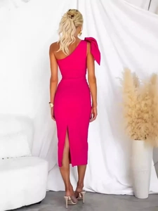 Fuchsia one-shoulder bodycon bandage dress with a large bow detail and back slit view