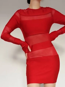 Close-up detail of sheer mesh paneling and thumbhole cuff on a red bodycon dress