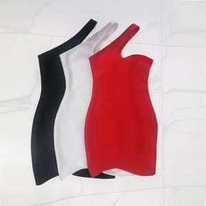Flat lay of slim fit one shoulder mini bandage dresses in black, white and red colors