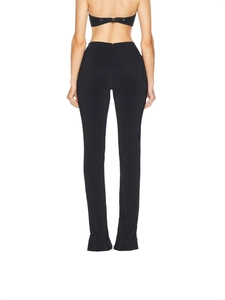Back view of women's black high-waisted slim trousers with hidden rear zipper closure