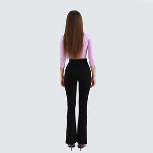 Rear view of slim fit purple crop top and black high waist flared pants for women