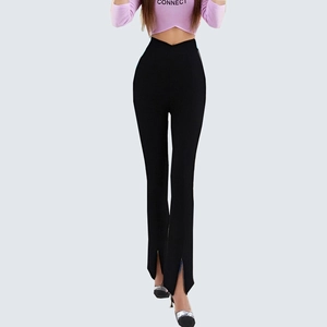 Detail of high waisted black flare trousers featuring a deep V-cut waist and front leg slits