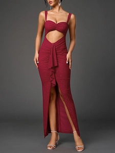 Detail of wine red evening gown with sequin texture, waist cutout and side slit