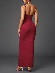 Detail showing the ruched design and red sequin mesh fabric on the back of the dress